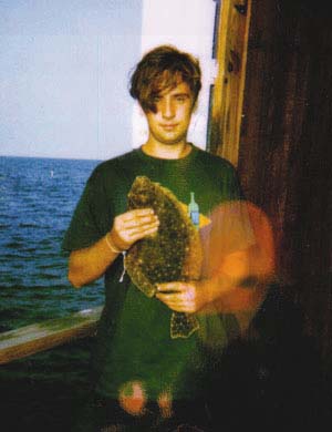 a flounder from the Chesapeake Bay being held by Matthew Hart
